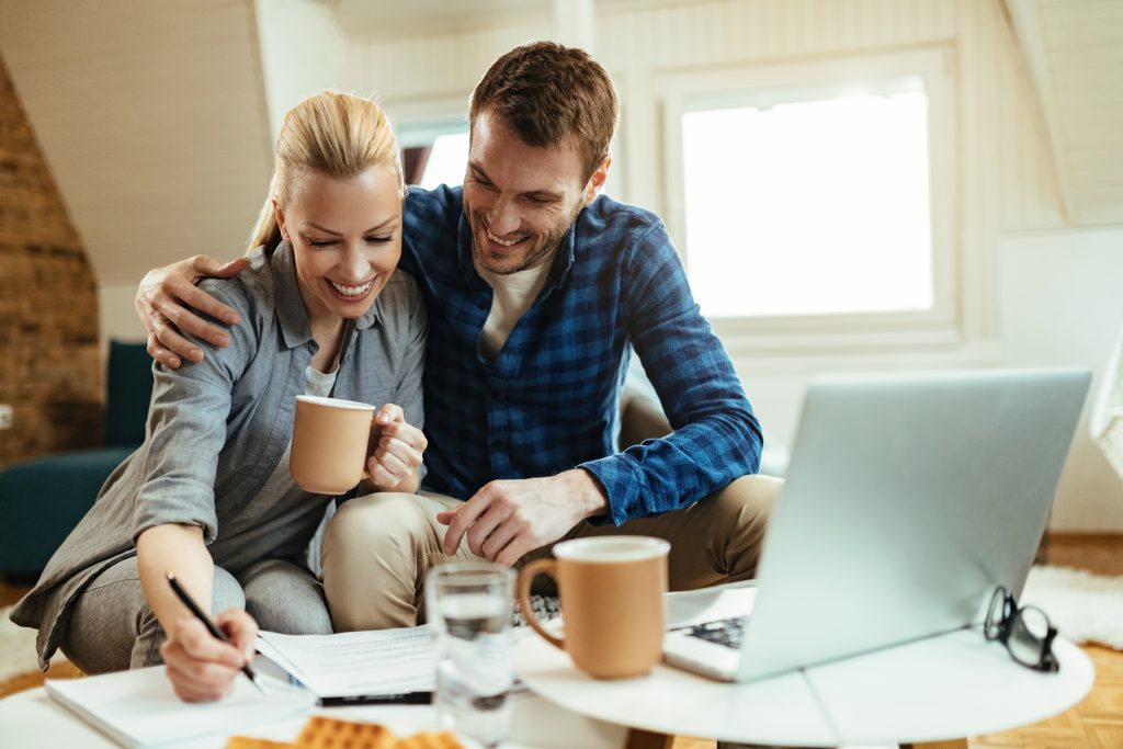 financial freedom reviewing finances with two people to help prosper during economic downturns
